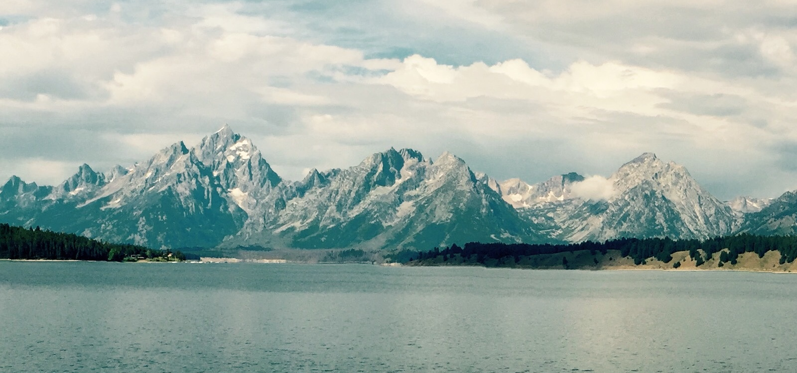 Grand Teton mountain range at dusk, the long-standing image behind the Newpoint Gas brand